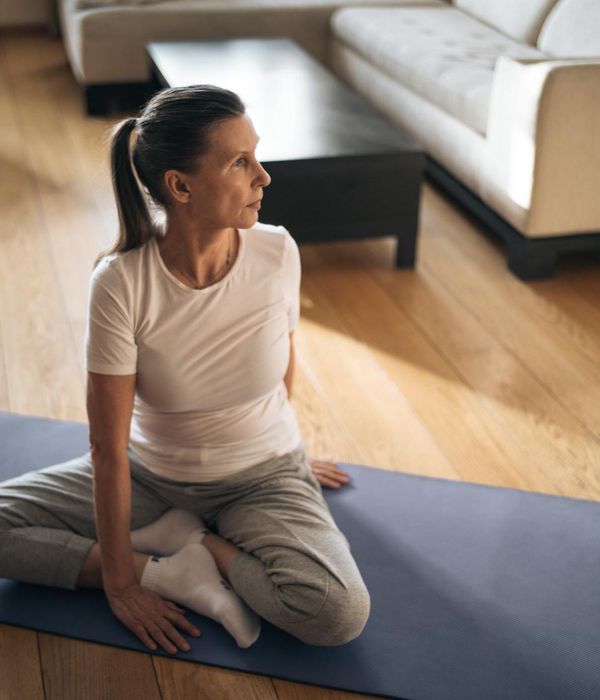 Woman stretching gracefully, embodying energy and flexibility.